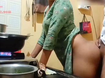 Watch this Indian Milf with a huge booty get down and sloppy in the kitchen