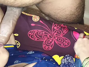 An Indian unladylike is giving her circle to her husband near Hindi